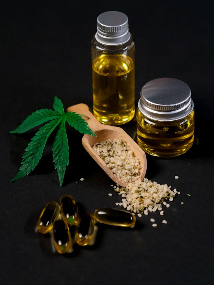 Mastering the First Impression: Your intriguing post title goes here A set of CBD products including oil, capsules, hemp seeds, and a cannabis leaf, presented on a dark backdrop.